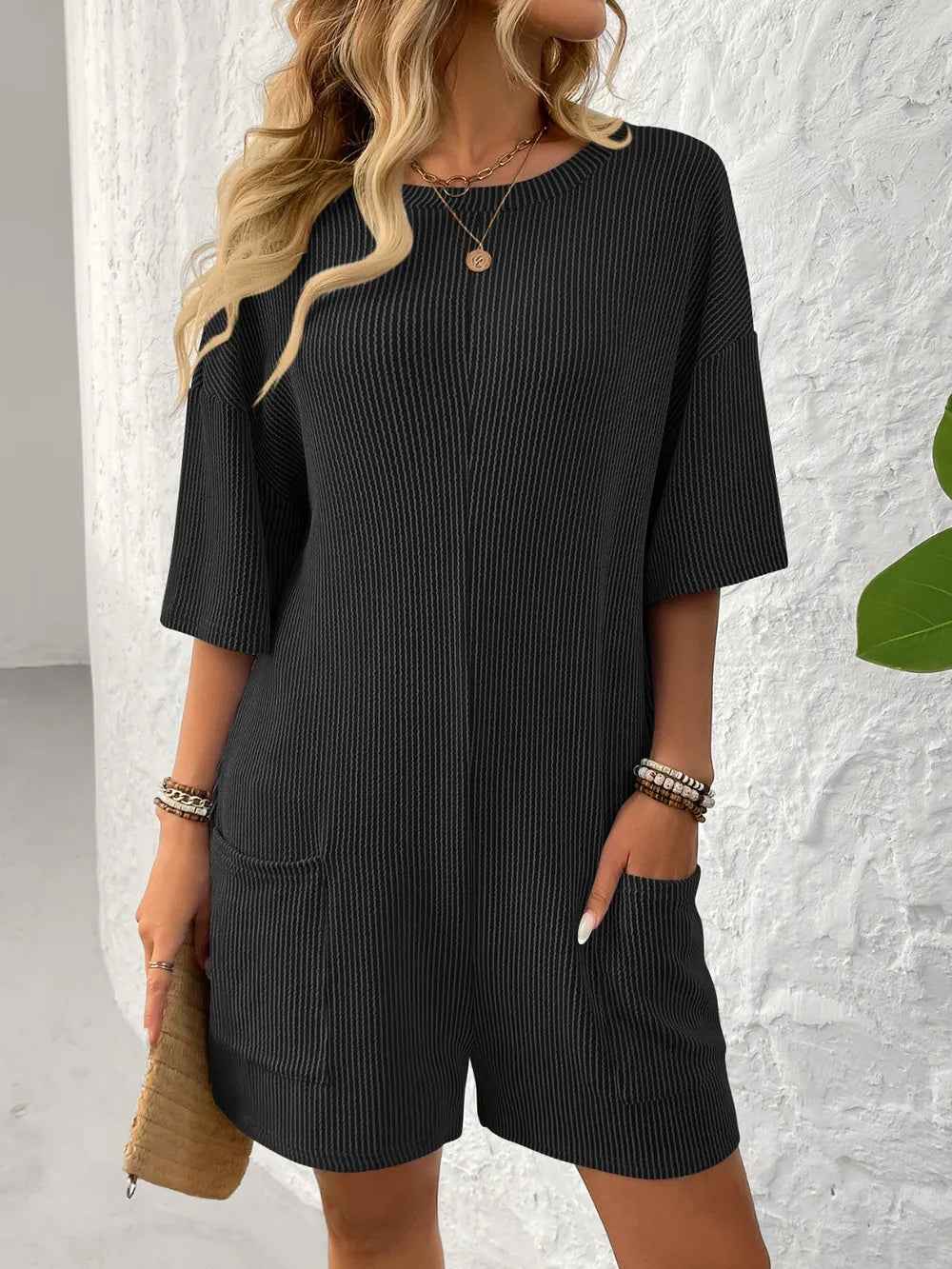 Backless Textured Romper for a Casual Chic Look